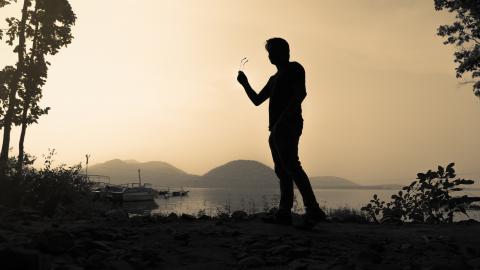 Silhouette of a tourist at Chandil Dam